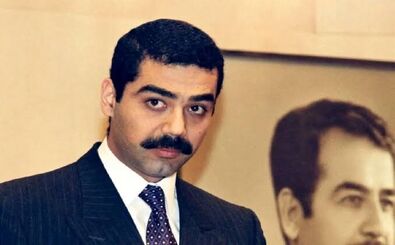 پسر بی‌رحم صدام در حال غذا دادن به شیرهایش/ عکس